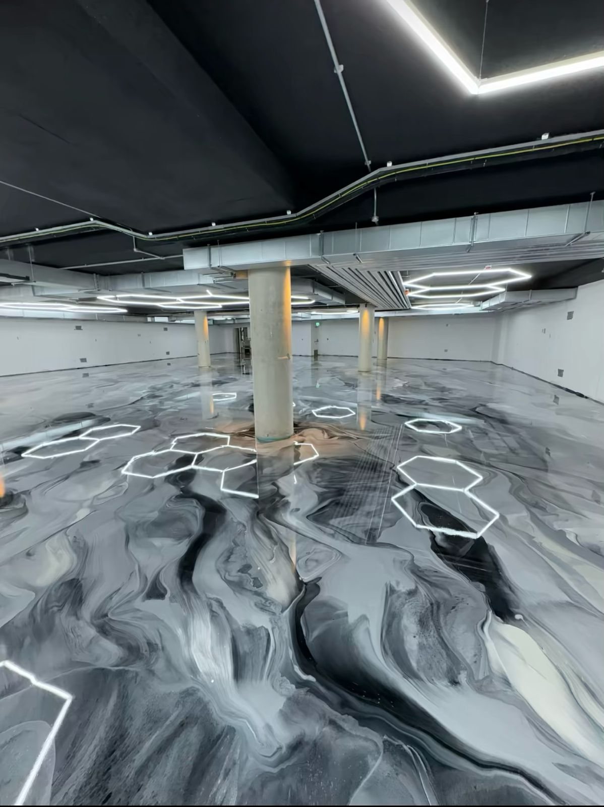 Metallic epoxy floor by Glosstek